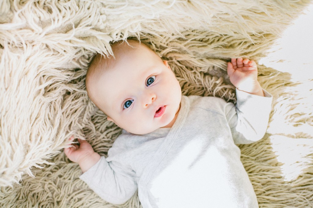 Canva - Baby in White Onesie